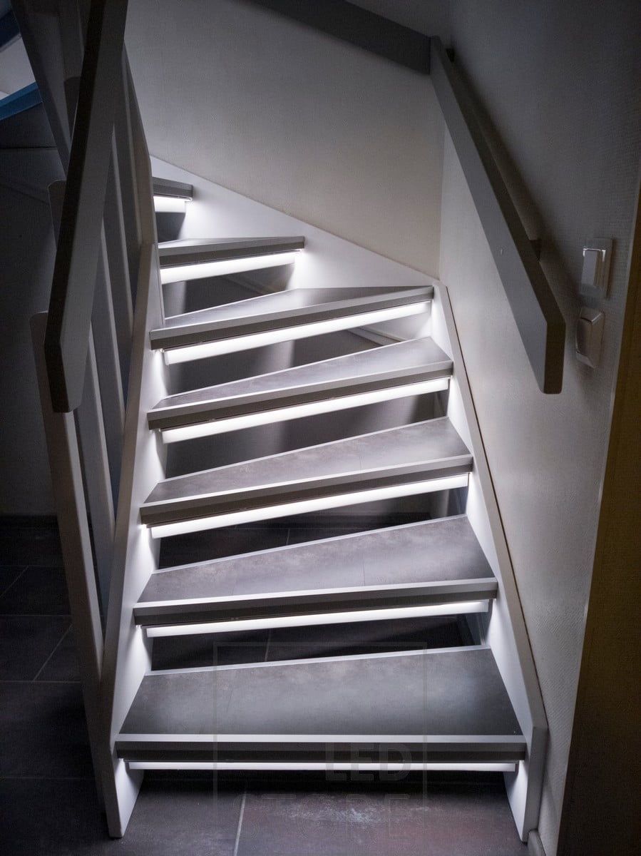Staircase lighting with LED strips beautifully highlights the steps.